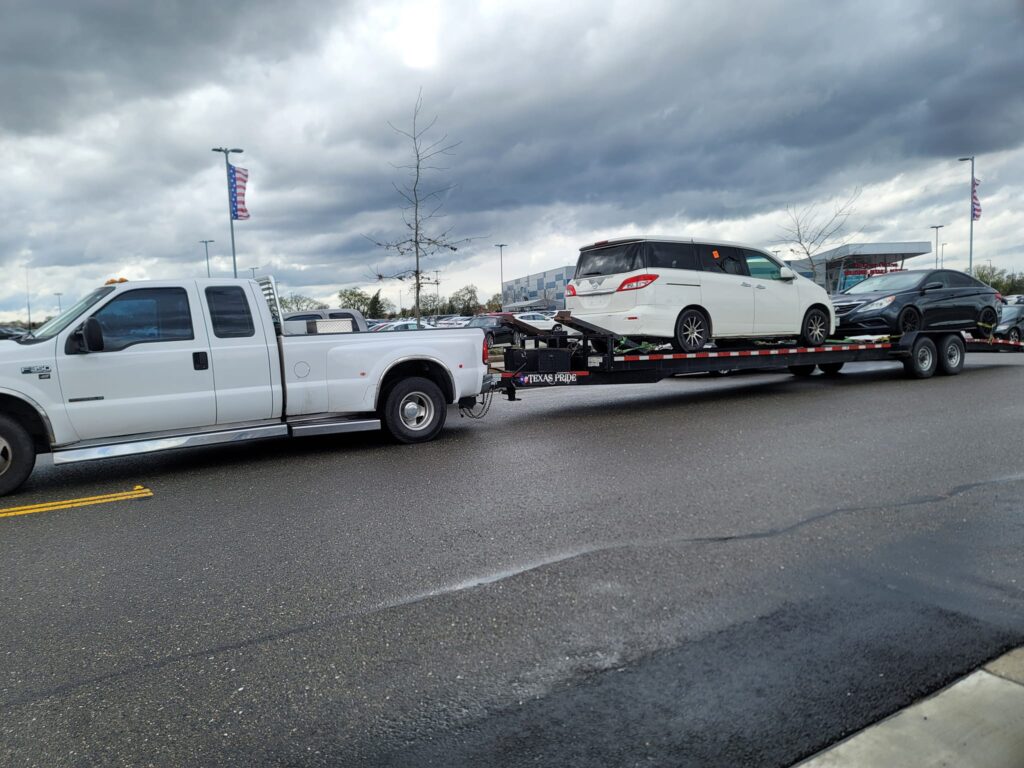 2 car hauling Menas Towing Log DIstance Towing Service